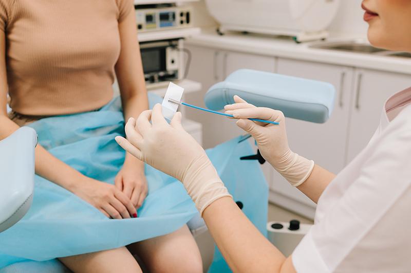 Cervical cells on a slide used by a gynaecologist to assess abnormal Pap smear results