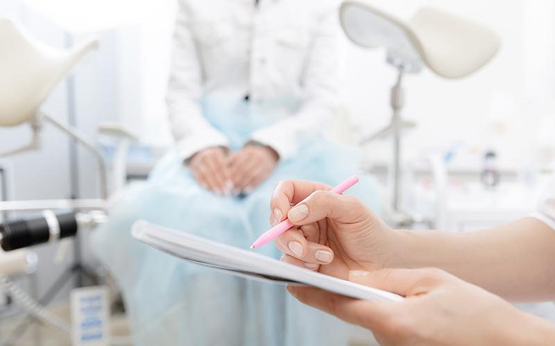 Young woman consulting a gynaecologist during an appointment in a clinical setting