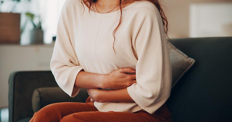 Woman experiencing pelvic pain associated with endometriosis