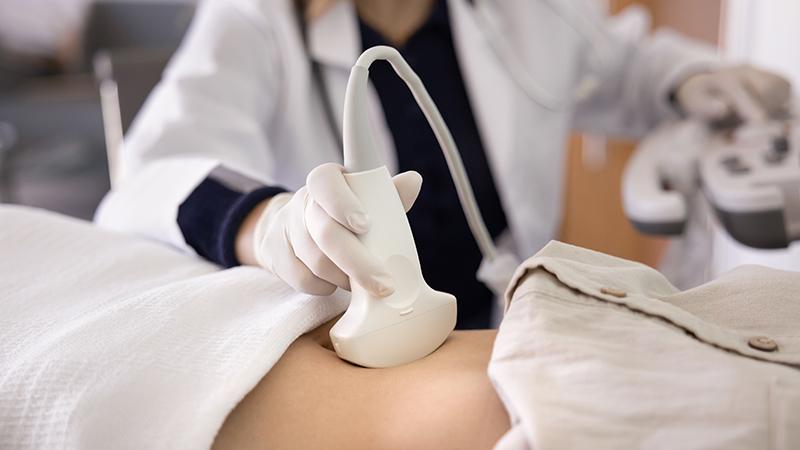 A Singapore obstetrician performing an antenatal check-up